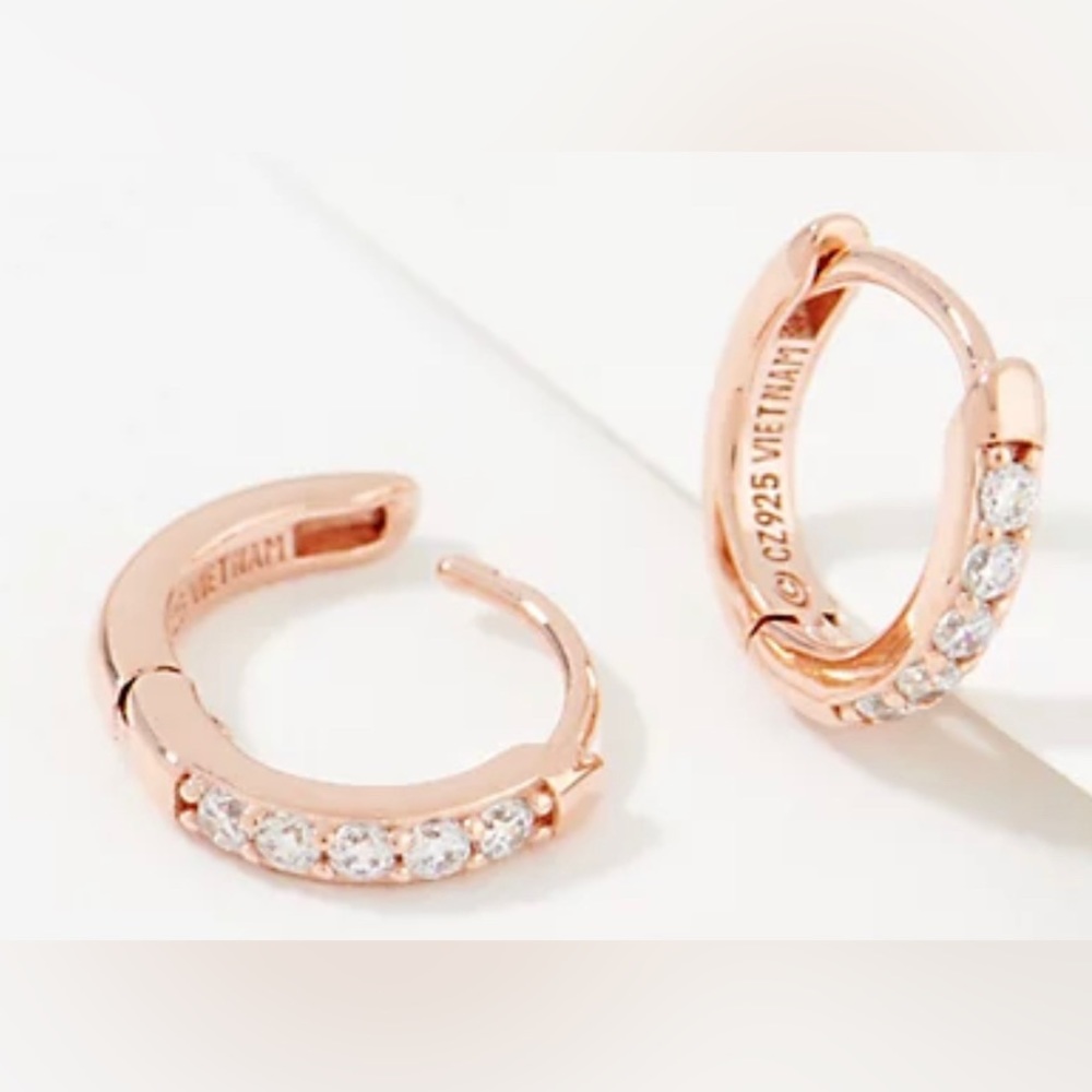 Diamonique rose gold huggie earrings.